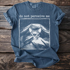 Blue t-shirt with a cat peeking out from under a blanket and the text "do not perceive me".