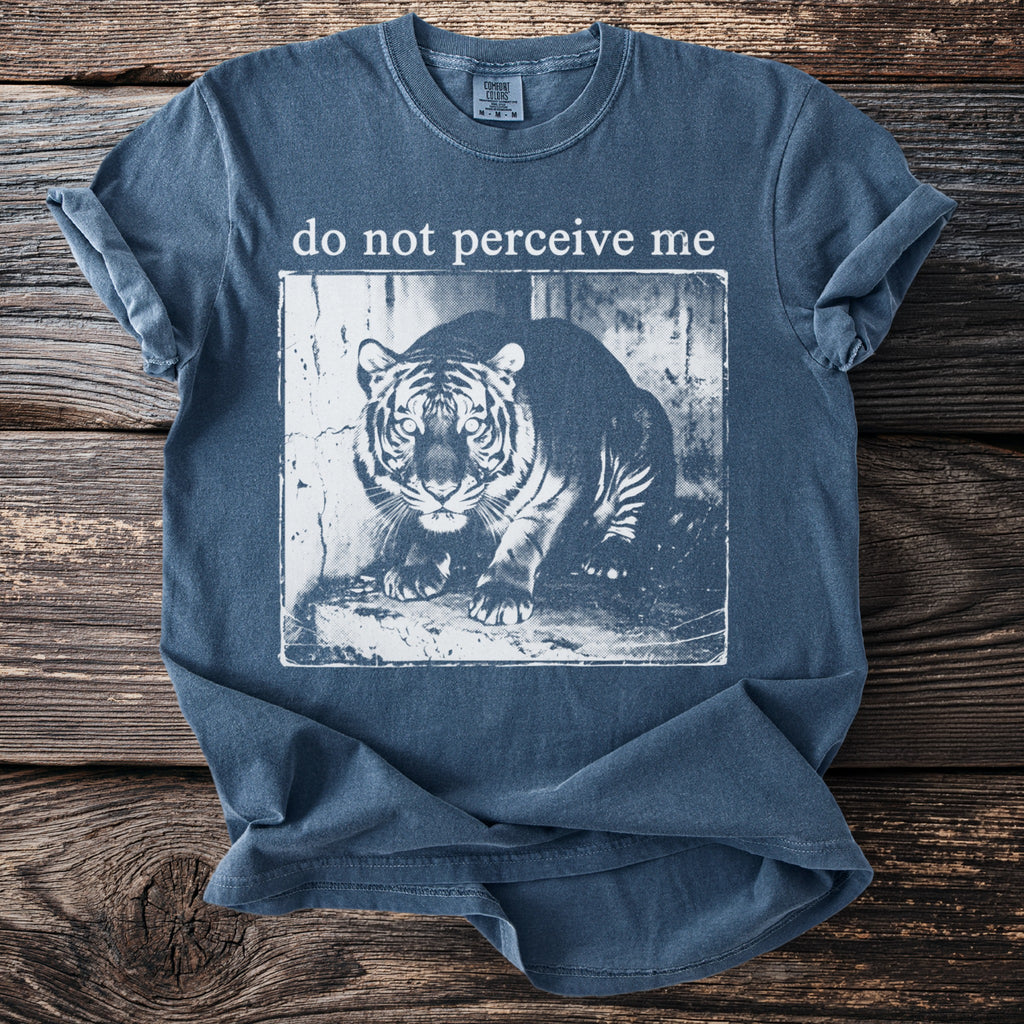 Blue t-shirt with a black and white tiger graphic and text "do not perceive me".