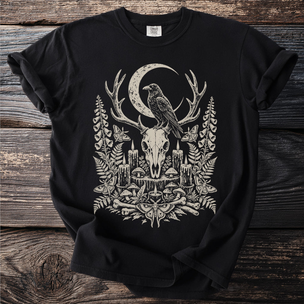 Black t-shirt with a dark, vintage-style graphic featuring a deer skull, raven, and crescent moon.