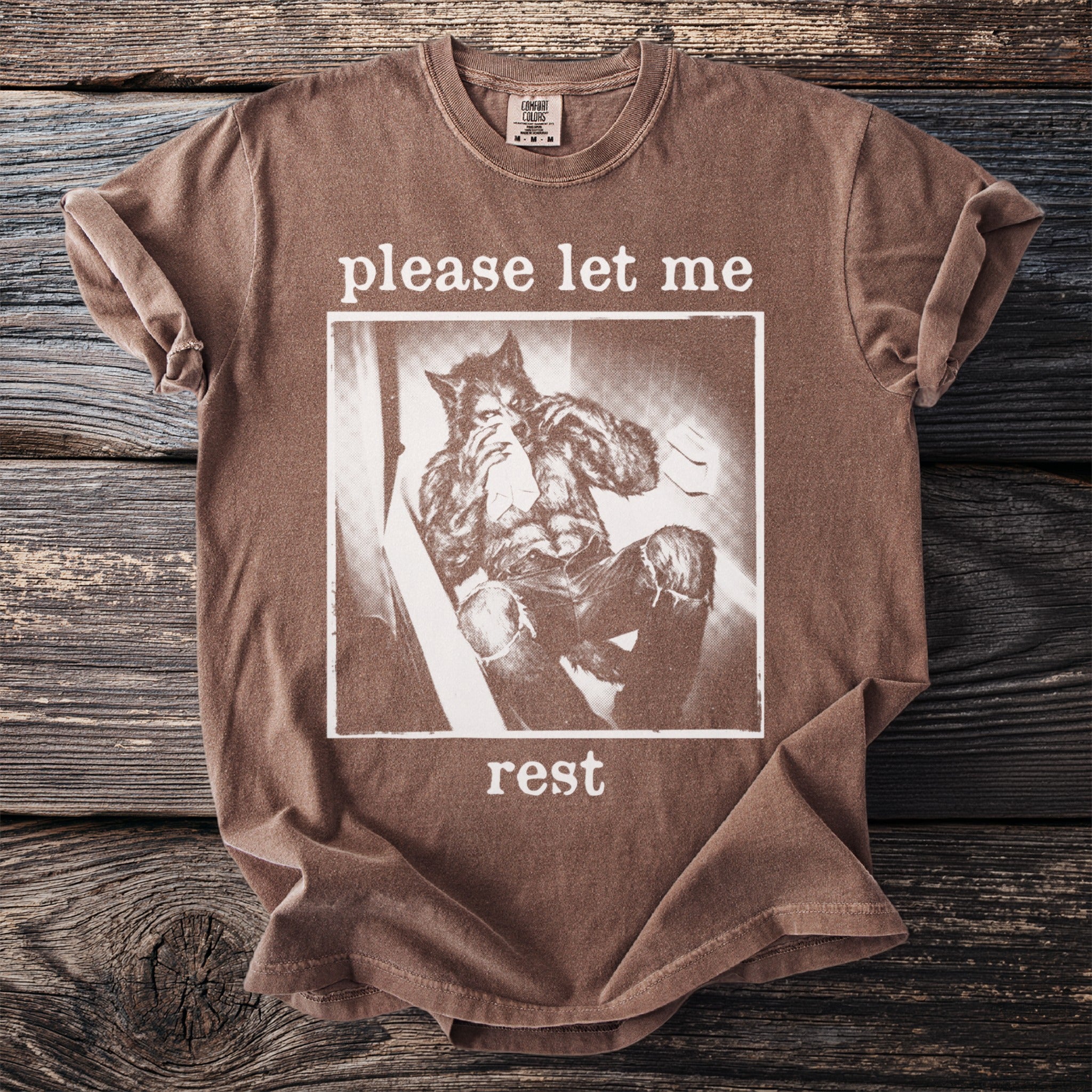 Brown t-shirt with werewolf graphic and "please let me rest" text.