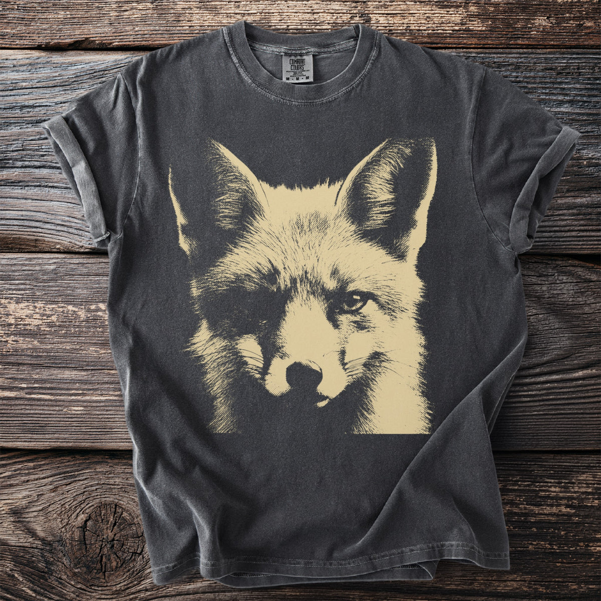 Charcoal t-shirt with a faded tan fox face graphic and "Comfort Colors" neck tag.