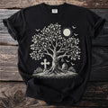 Black t-shirt with a tree, cross, tombstone, bell, moon, and bats.