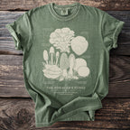 Green t-shirt featuring an illustration of various fungi including Lion's Mane and Hen of the Woods.