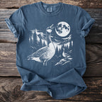 T-shirt with geese, mountains, trees, and a full moon graphic.