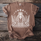 Brown t-shirt with white design of woman with roots, ferns, moon phases, and stars.