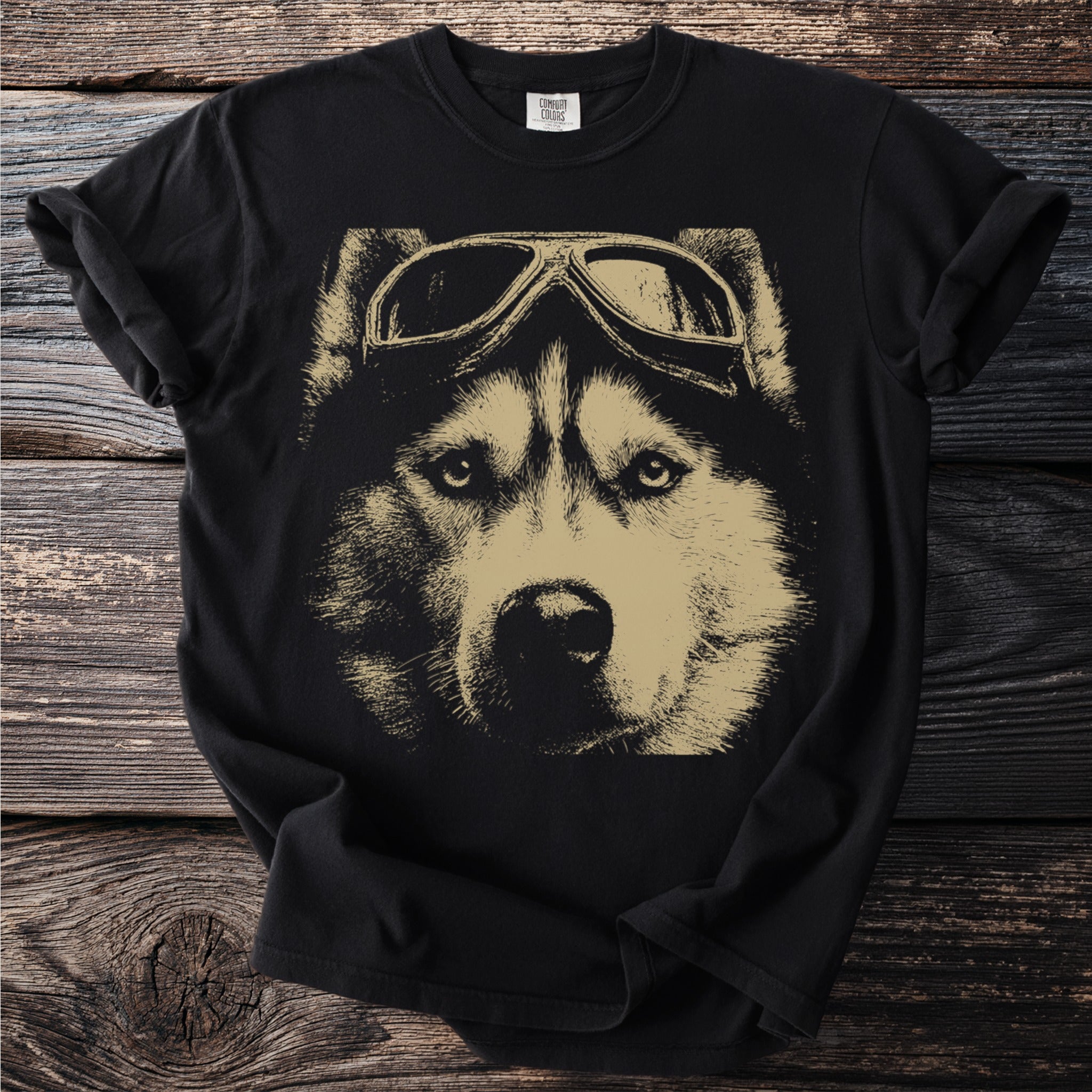 Black t-shirt with a gold graphic of a husky dog wearing aviator goggles.