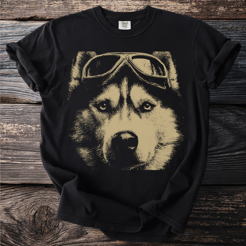 Black t-shirt with a gold graphic of a husky dog wearing aviator goggles.