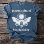 Blue t-shirt with moth illustration and text "patron saint of bad decisions".