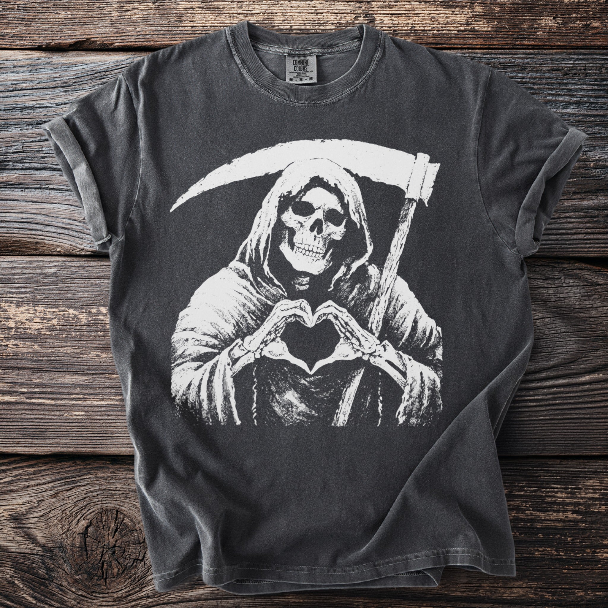 T-shirt with a grim reaper making a heart shape with its hands.