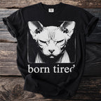 Black t-shirt with a black and white halftone print of a Sphynx cat and the text 'born tired'.
