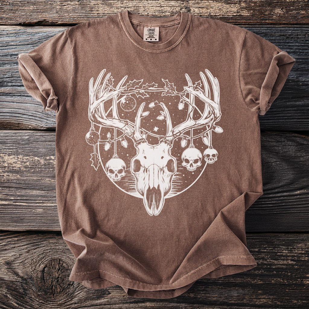 Brown t-shirt with white deer skull graphic featuring ornaments and skulls.