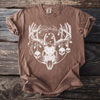 Brown t-shirt with white deer skull graphic featuring ornaments and skulls.