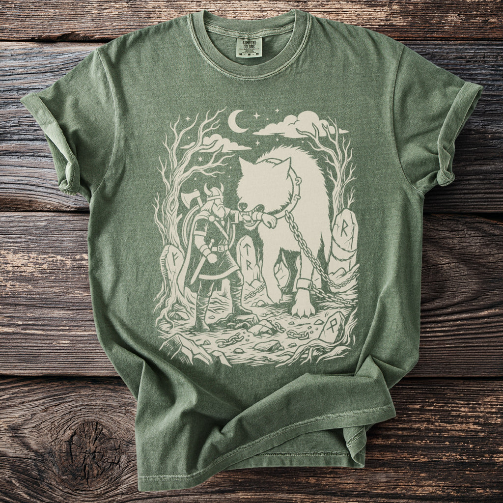 Green t-shirt with a Viking warrior facing a chained wolf under a crescent moon.