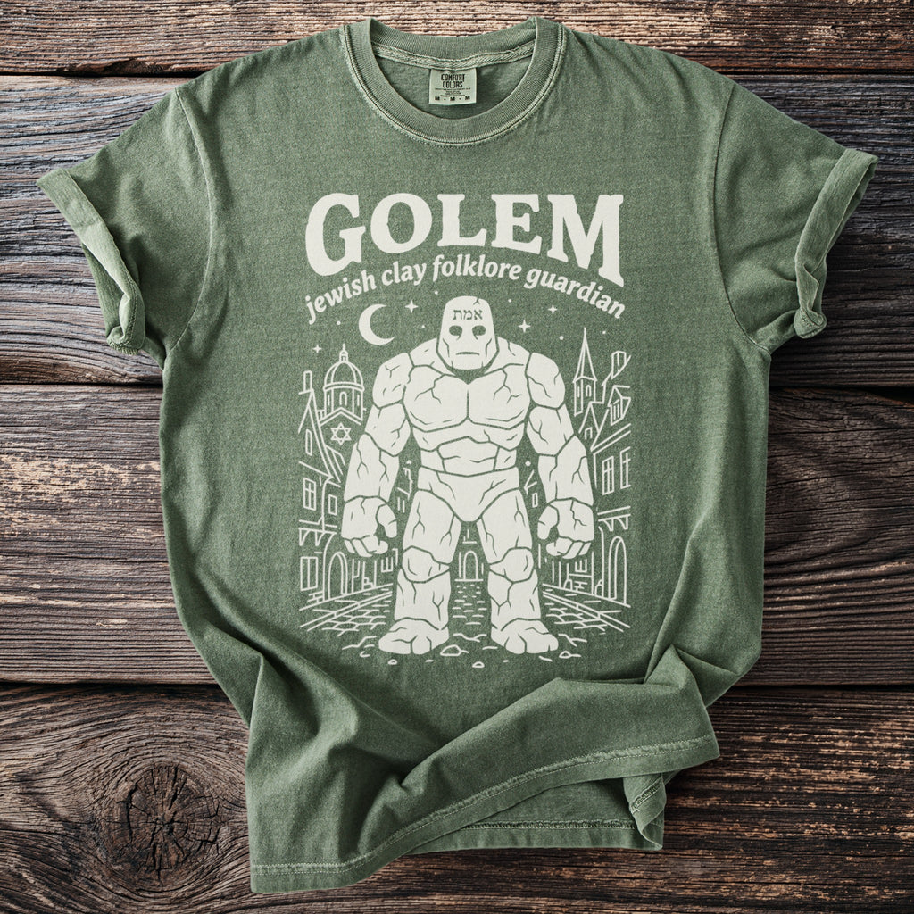 Green t-shirt with a golem illustration and text: "GOLEM jewish clay folklore guardian."