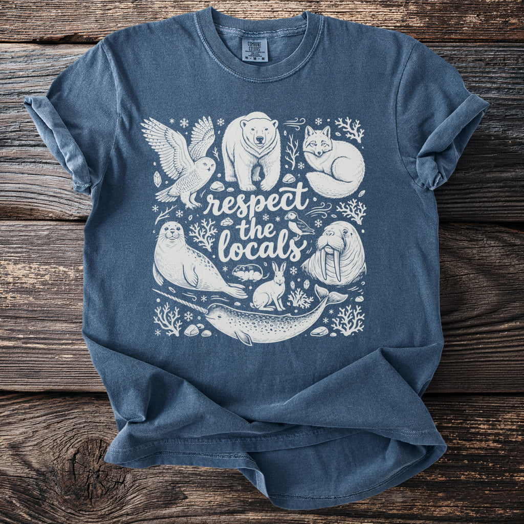 Arctic animals and text "respect the locals" screen printed on a blue t-shirt.