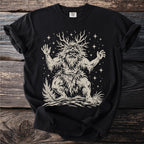 Black t-shirt with a beige illustration of a forest spirit with antlers and stars.