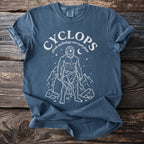 Blue t-shirt with a white graphic of a cyclops and text "CYCLOPS greek mythology one eyed giant".