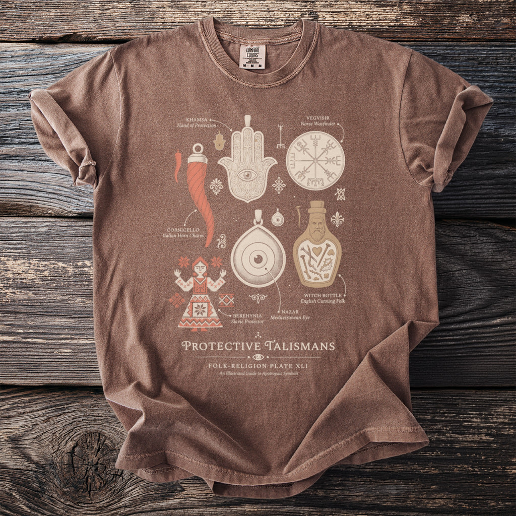 Brown t-shirt with "PROTECTIVE TALISMANS" and various illustrated protective symbols.
