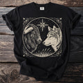 Black t-shirt with a musk ox and wolf facing beneath a north star.