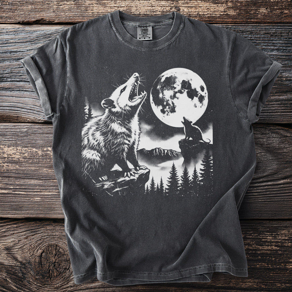 T-shirt with graphic of possum and smaller creature howling at a full moon.
