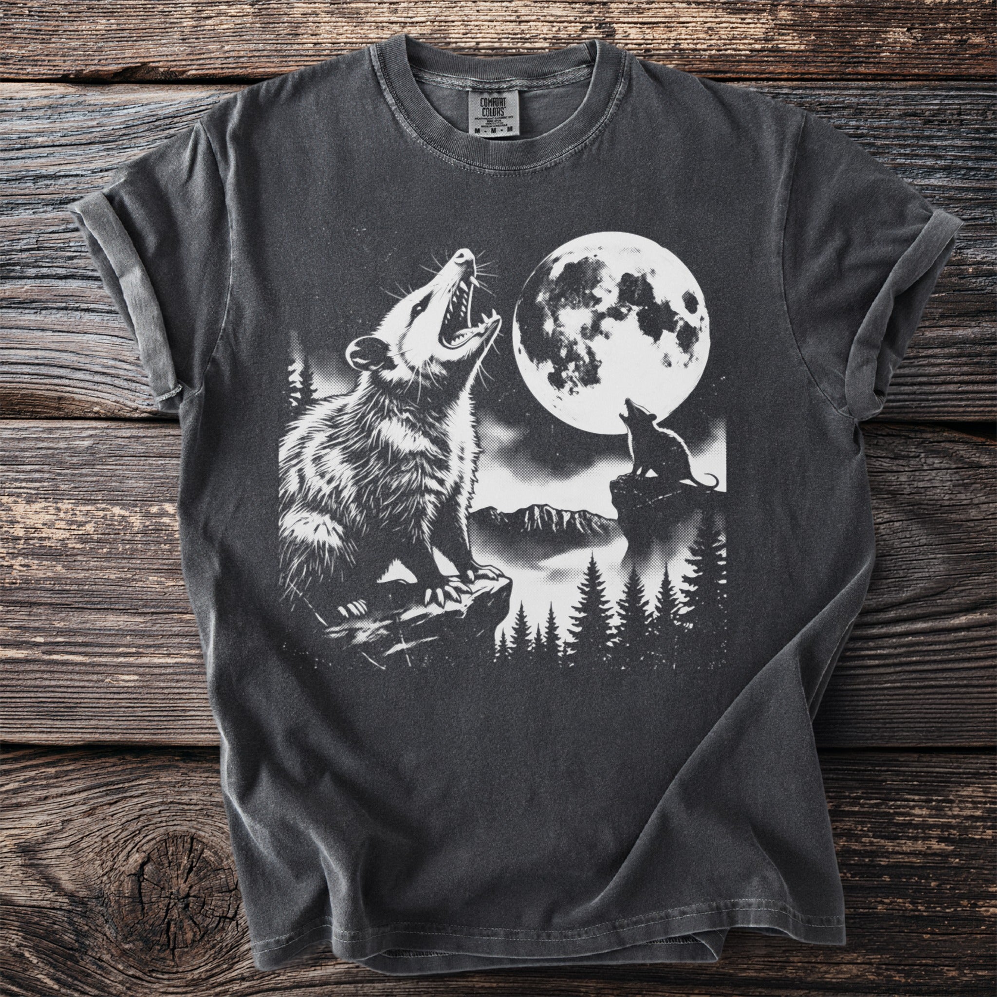 T-shirt with graphic of possum and smaller creature howling at a full moon.