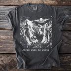 Dark t-shirt with graphic of ghostly figures in a cornfield holding a pumpkin.