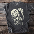 Dark gray t-shirt with haunted church, bats, and monk ghost graphic.