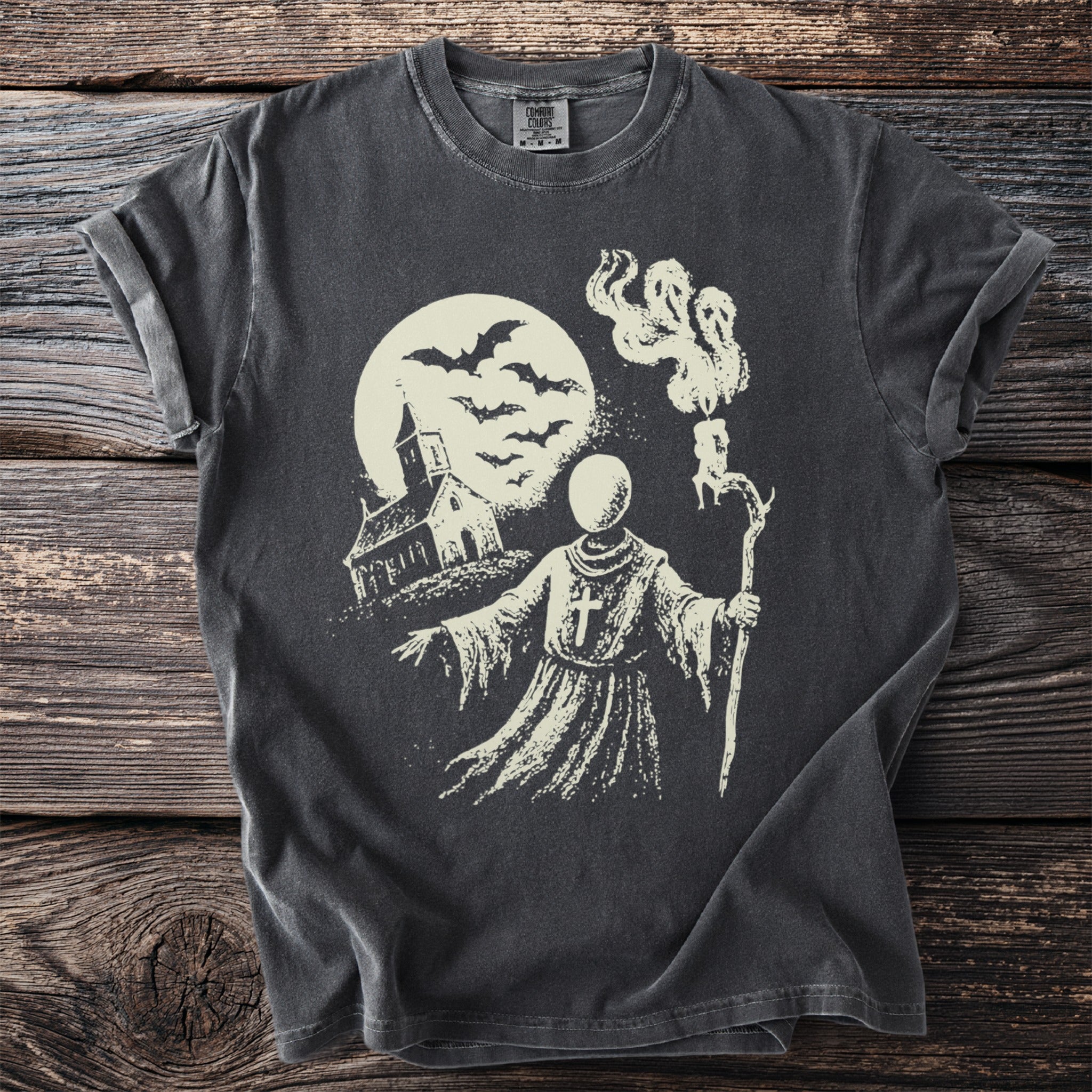 Dark gray t-shirt with haunted church, bats, and monk ghost graphic.