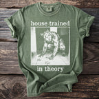 Green t-shirt with a werewolf illustration and the text "house trained in theory".