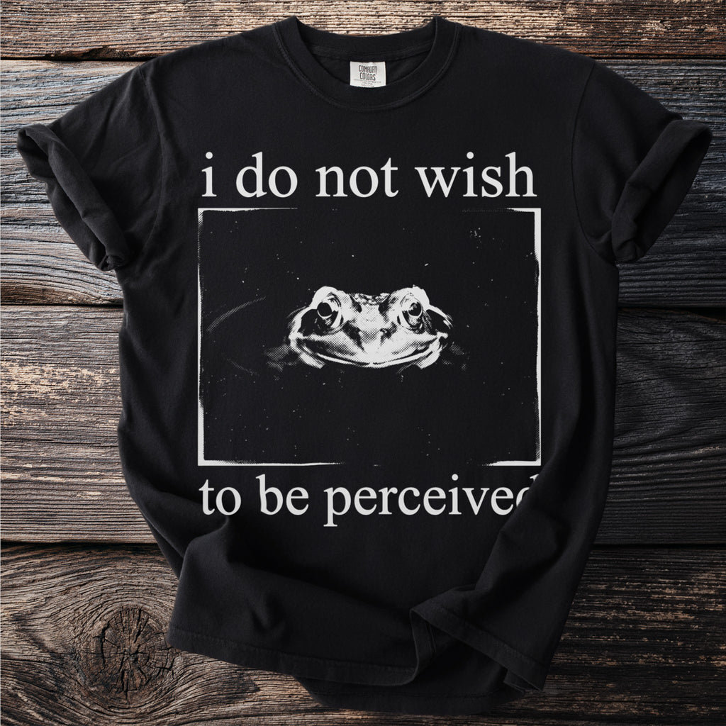 Black t-shirt with white text and a frog portrait saying "i do not wish to be perceived".