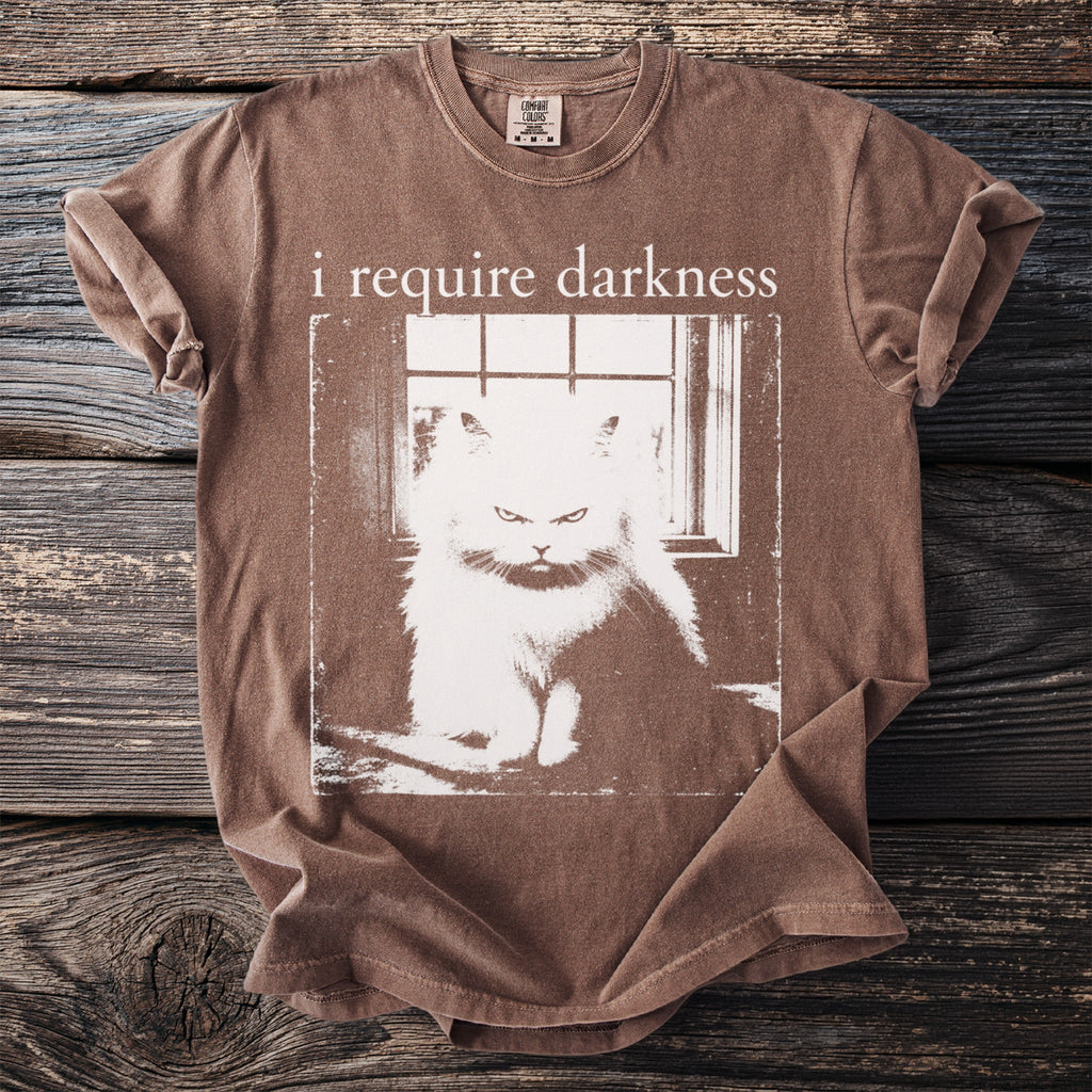 Brown t-shirt with distressed print of an angry cat and the text "i require darkness".