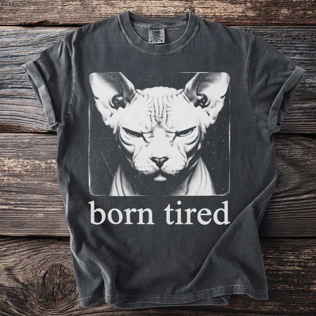 Dark grey t-shirt with a Sphynx cat graphic and the text "born tired".