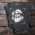 Dark t-shirt with a white skull wearing a beanie and a long beard.