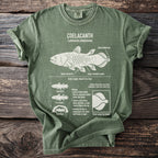 Green t-shirt with illustration and text about the Coelacanth fish.
