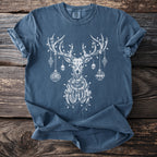 Blue t-shirt with white print of a skeletal deer with ornaments and lights.