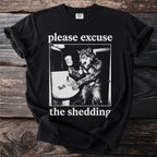 Black t-shirt with werewolf in bathroom and text "please excuse the shedding".