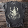 Dark t-shirt with an illustration of a deer skull, snakes, and kneeling figures in a circle.