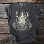 Dark t-shirt with an illustration of a deer skull, snakes, and kneeling figures in a circle.