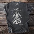 Dark t-shirt with white line art of a witch hat silhouette filled with foxglove and lily of the valley.