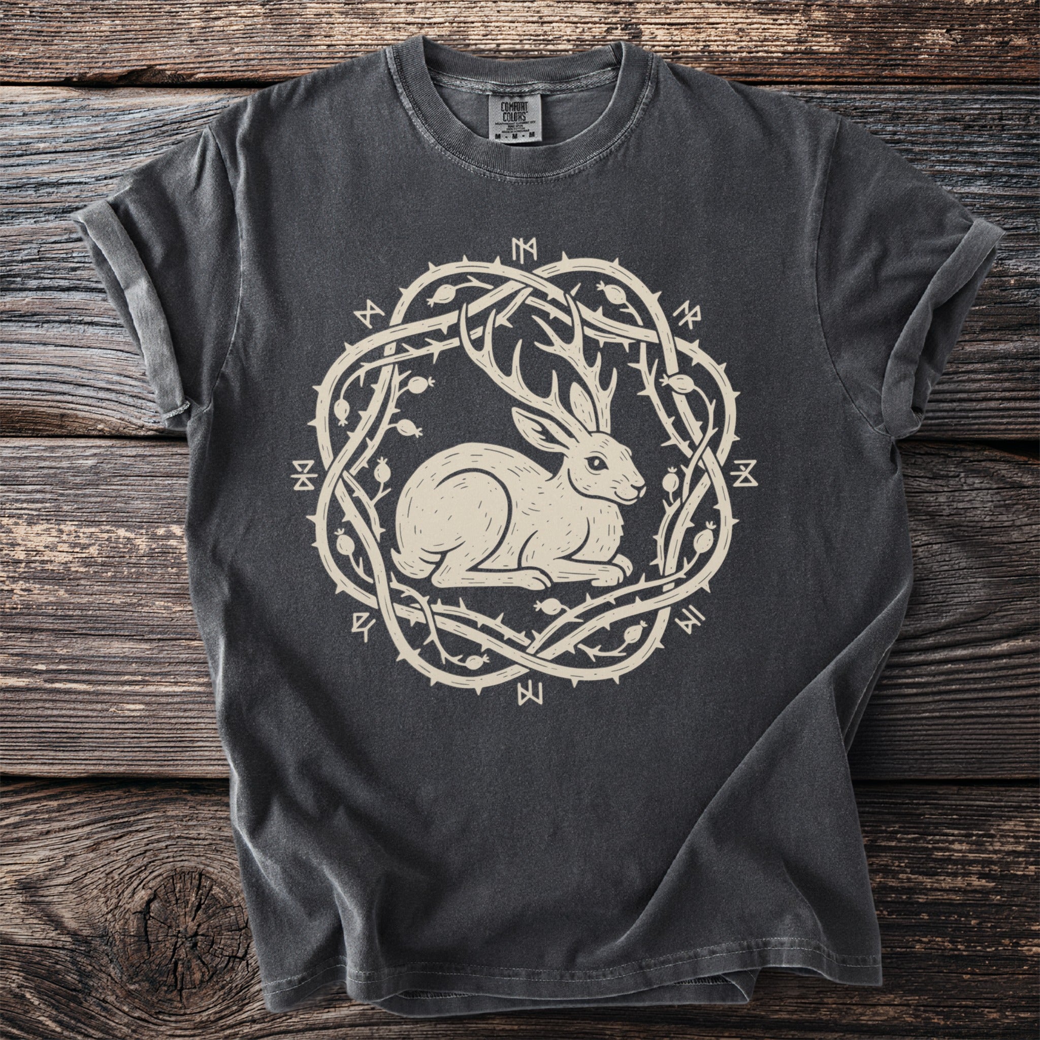 T-shirt with a rabbit, antlers, thorny vines, and Norse runes design.