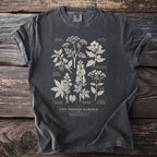 Dark grey t-shirt featuring white scientific illustrations of poisonous plants and Latin names.