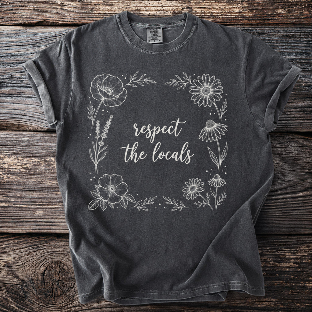Dark grey t-shirt with floral border and "respect the locals" text.