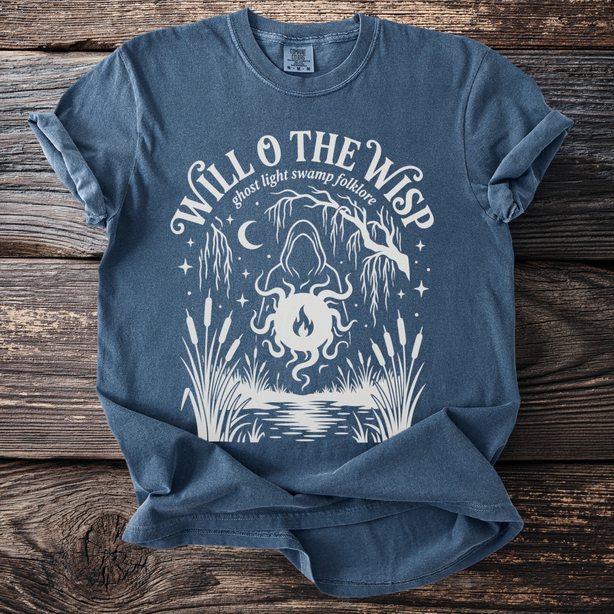 Blue t-shirt with white graphic "Will o the Wisp ghost light swamp folklore".