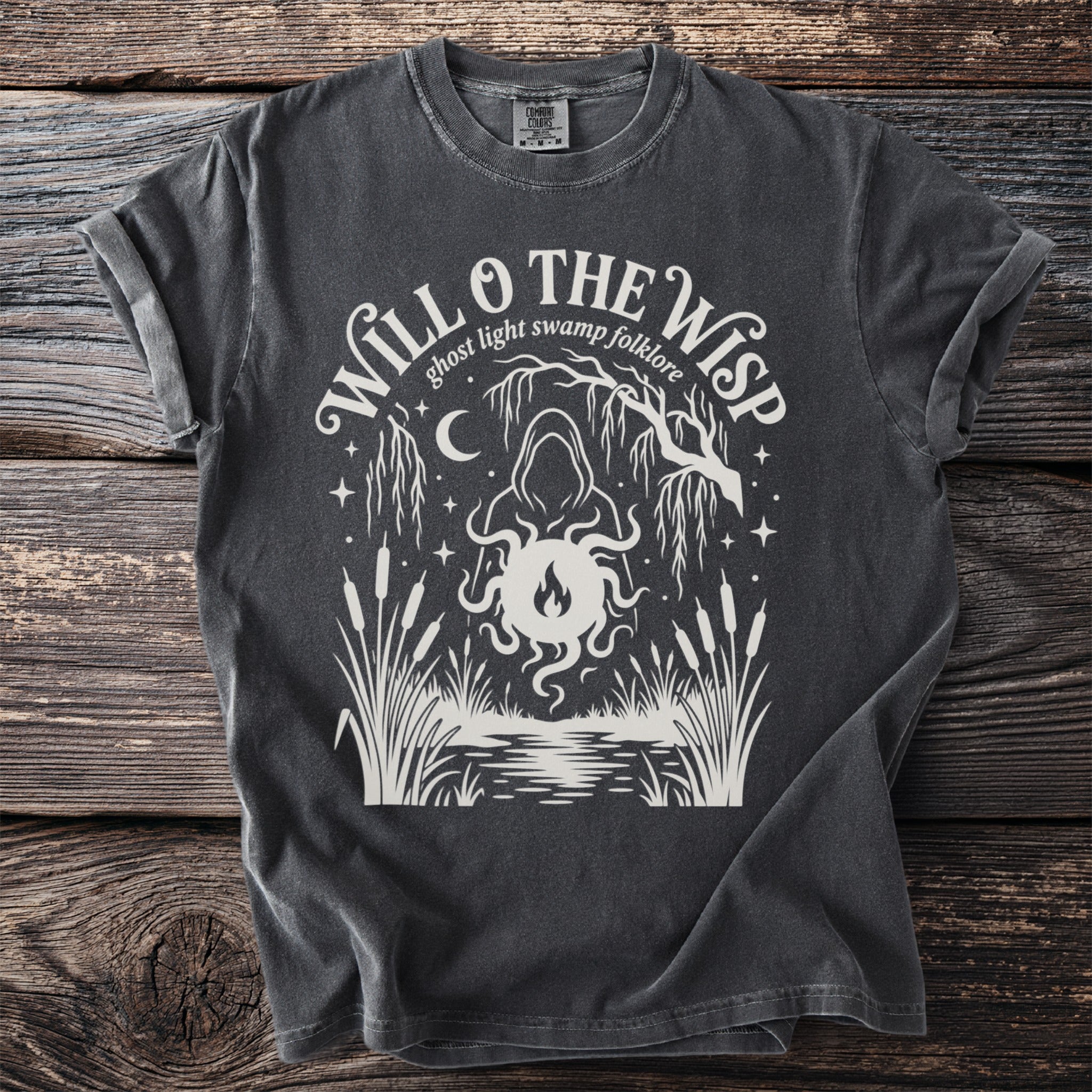 Dark gray Comfort Colors t-shirt with white "Will O' The Wisp ghost light swamp folklore" graphic.