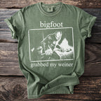 Green t-shirt with Bigfoot design and text "bigfoot grabbed my weiner".