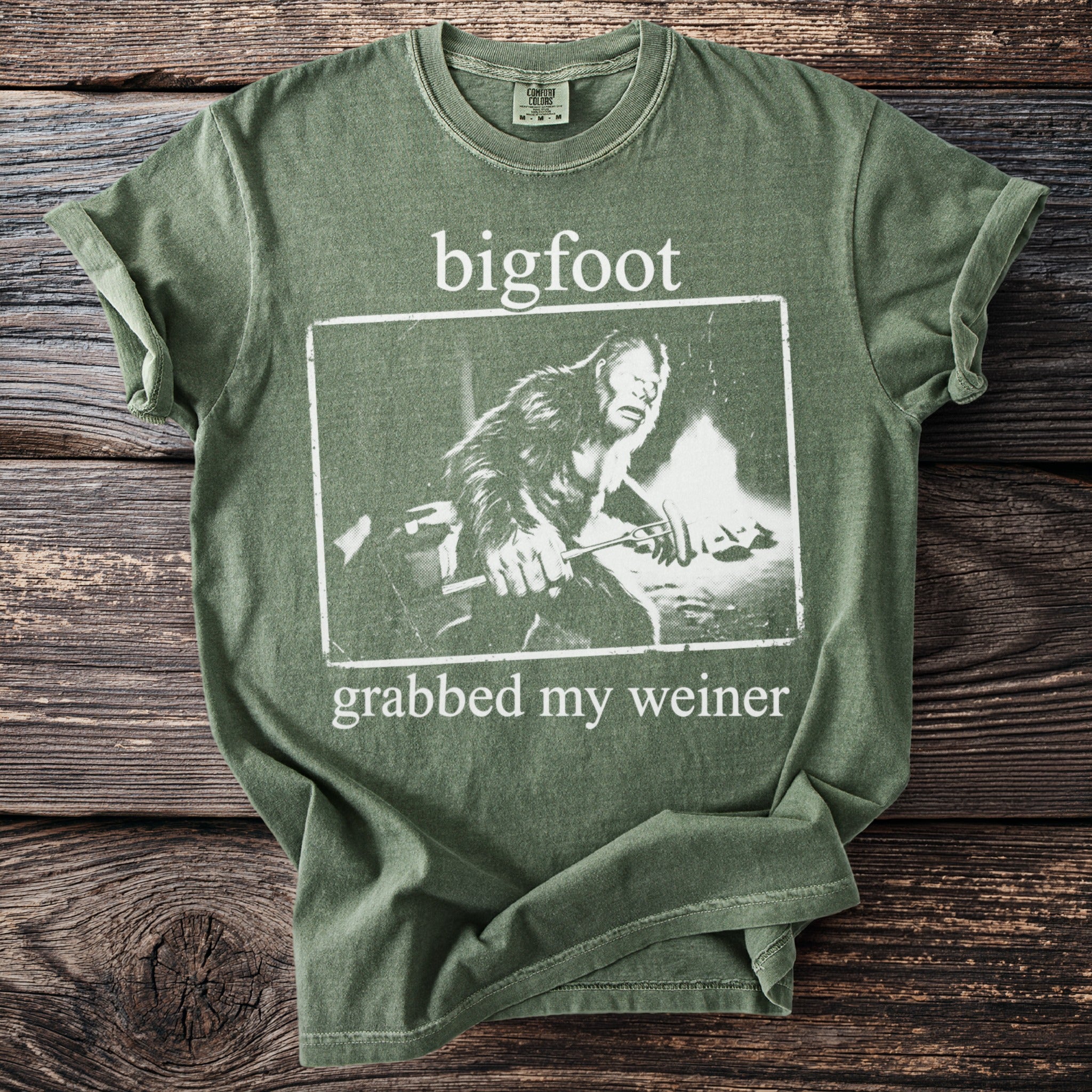 Green t-shirt with Bigfoot design and text "bigfoot grabbed my weiner".