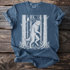 Werewolf in a forest with an owl and moon, printed on a blue t-shirt.
