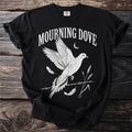 Black t-shirt with white graphic of a mourning dove, feathers, wheat, and moon.