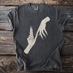 Dark t-shirt with illustration of two hands with long, sharp nails touching.