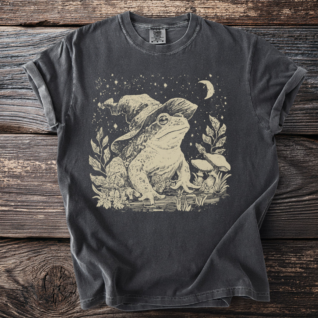 Dark gray t-shirt with distressed print of a wizard frog, mushrooms, and stars.